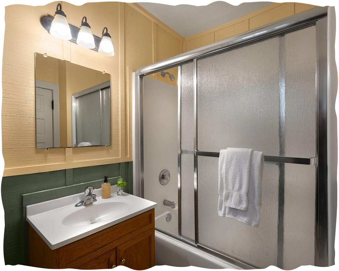 a bathroom with a shower and sink
