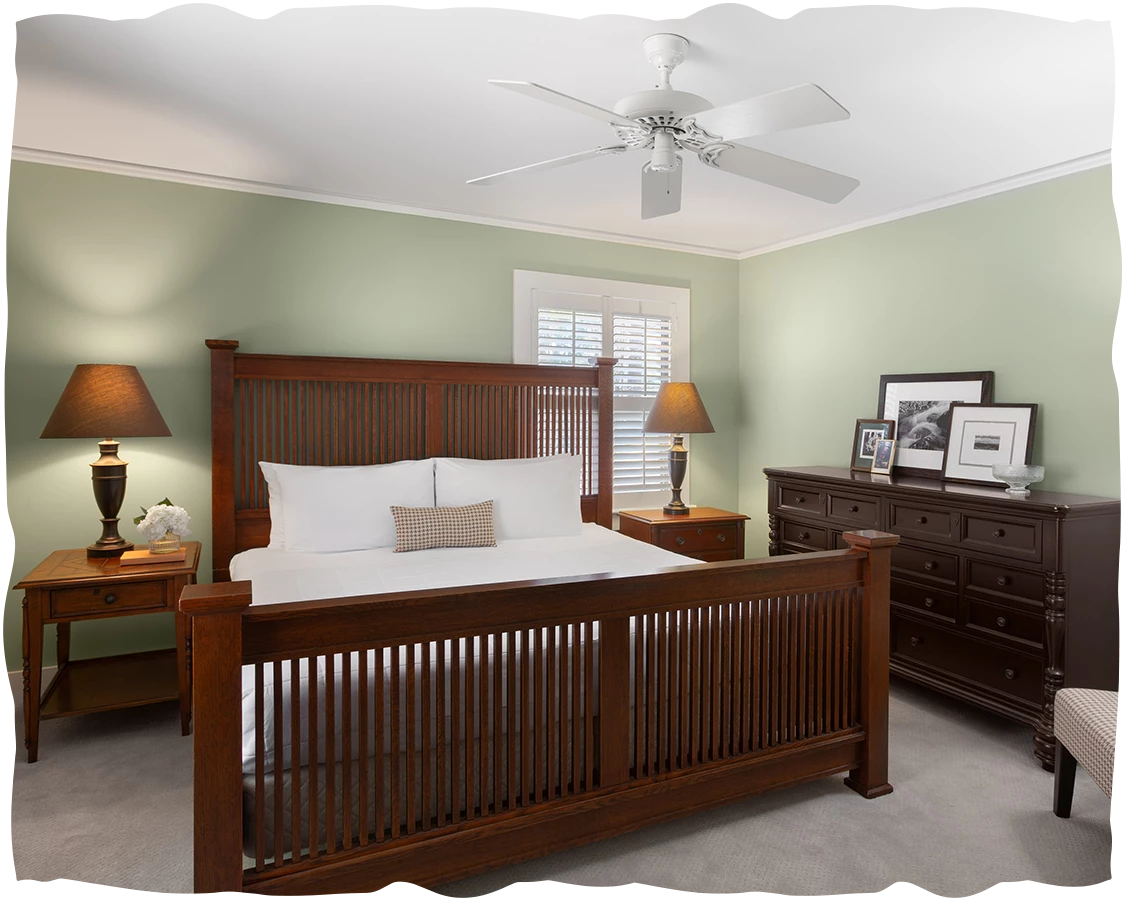 a bedroom with a bed and dresser