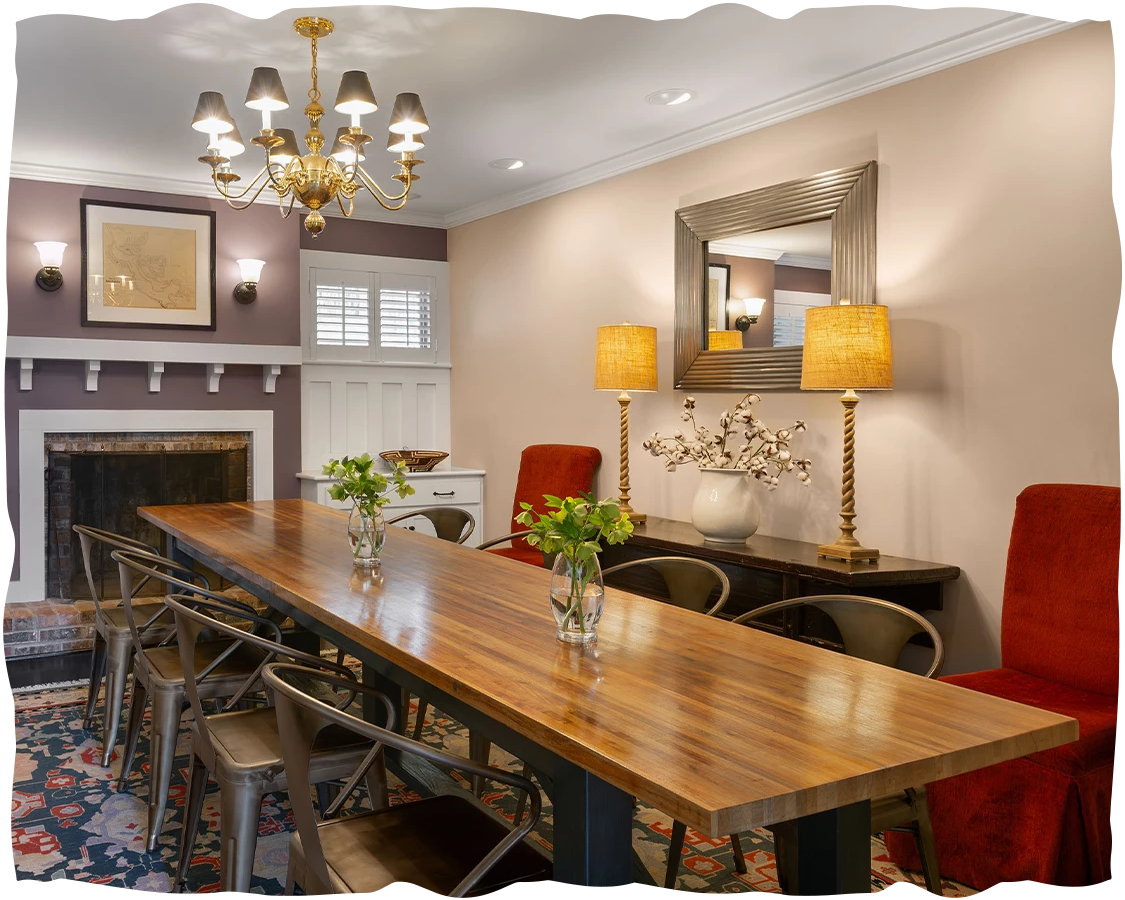 a room with a long table and chairs