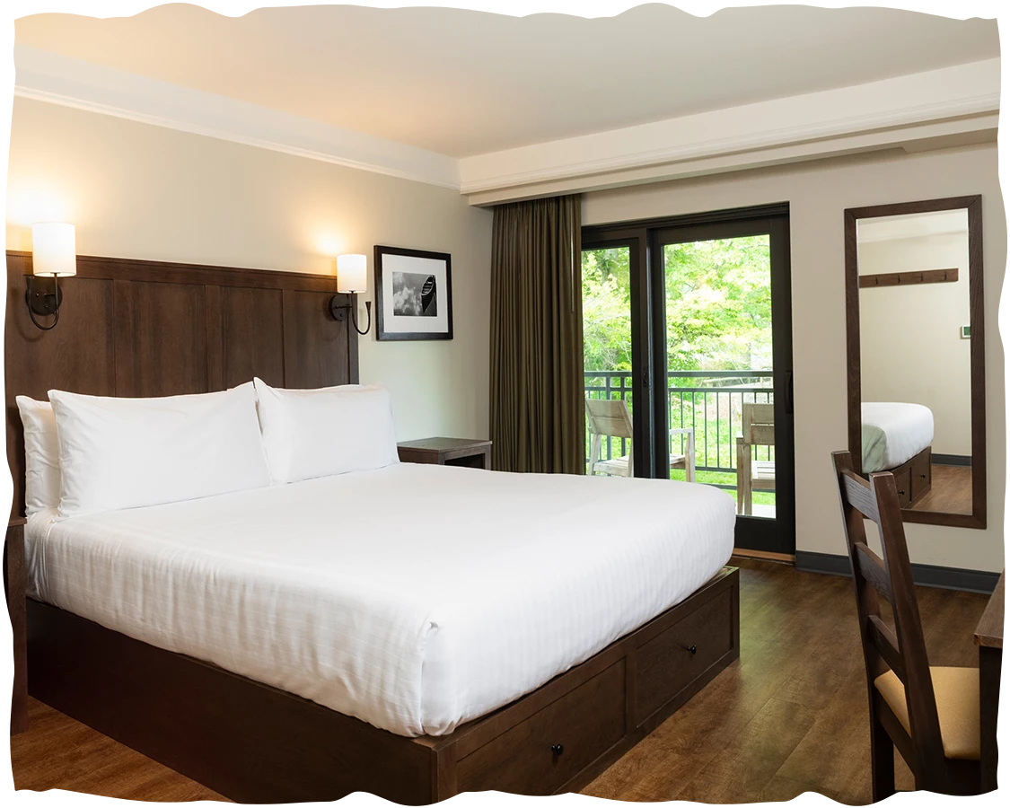 a bedroom with a bed and a door