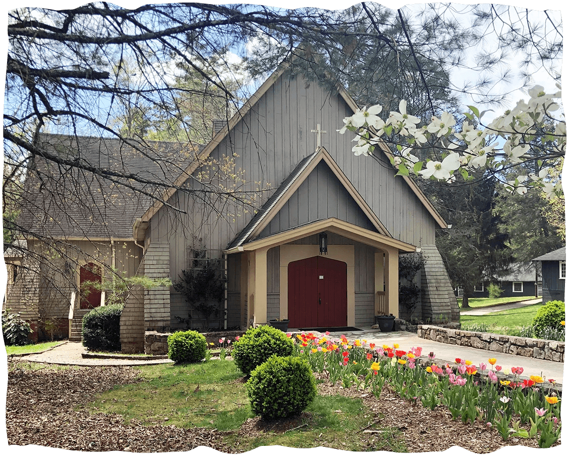 a church with a flower garden