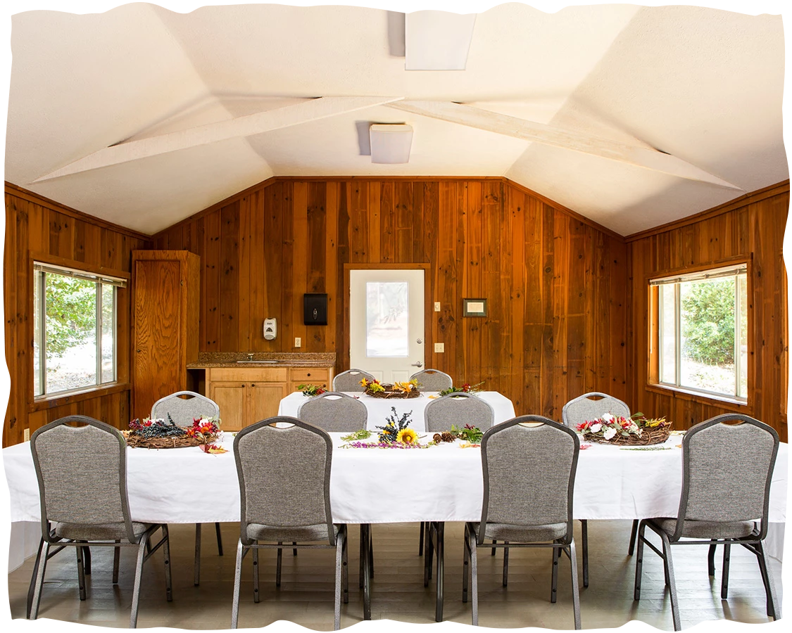 a room with a table set for a dinner