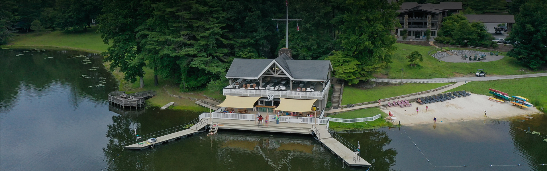 a building with a boat dock and people on it