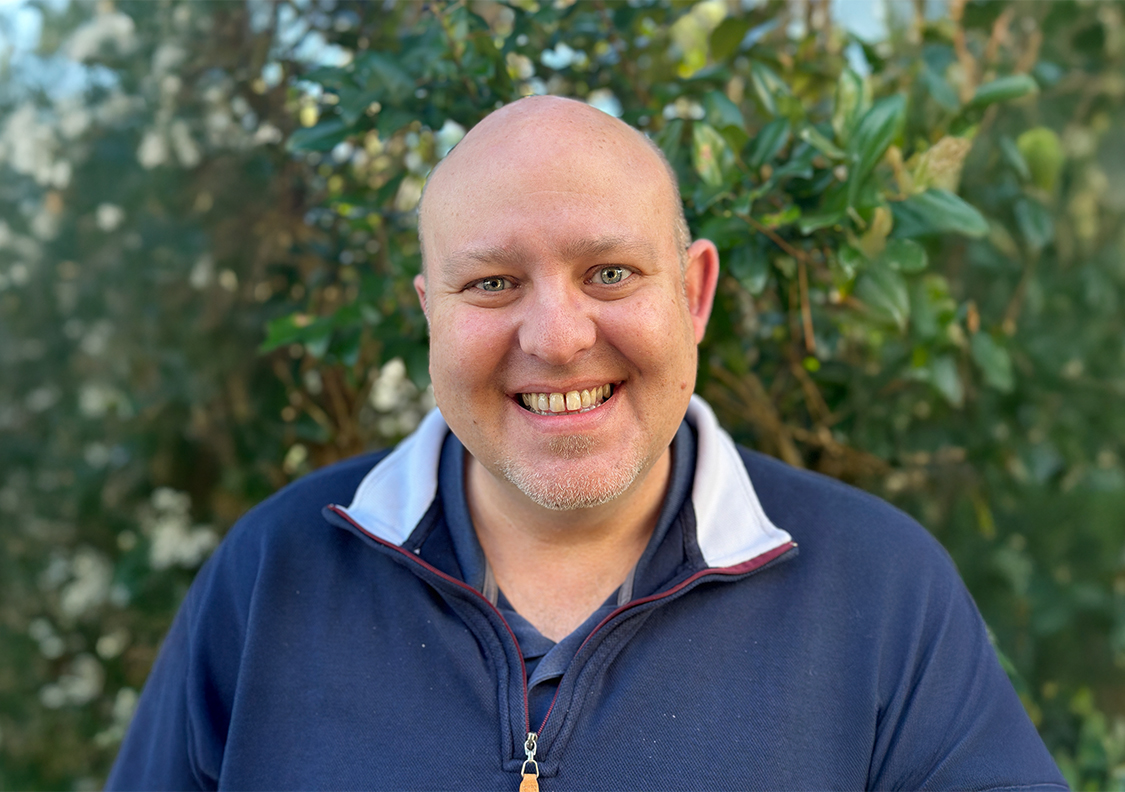 a man smiling for a picture