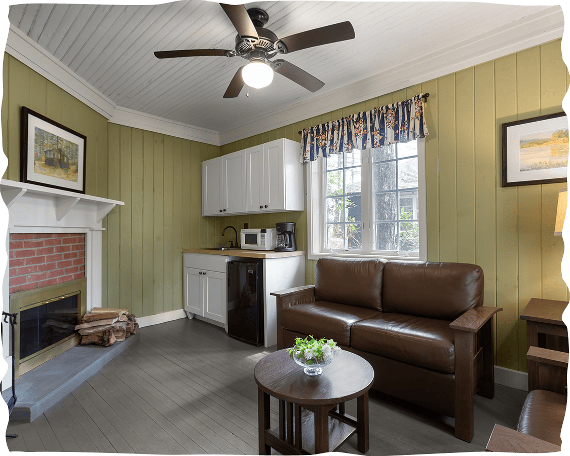 a living room with a fireplace and a couch