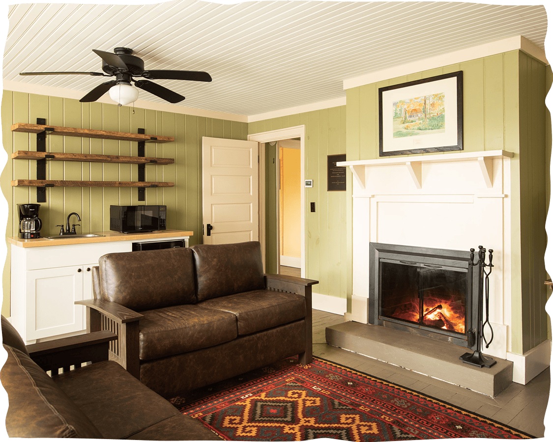 a living room with a fireplace and a couch