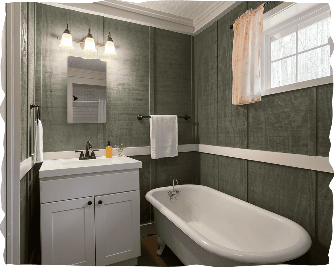 a bathroom with a tub sink and a mirror