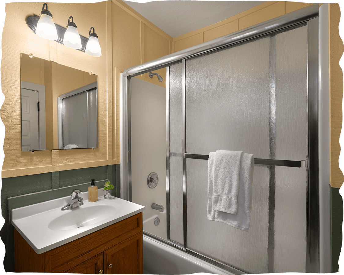 a bathroom with a shower and sink