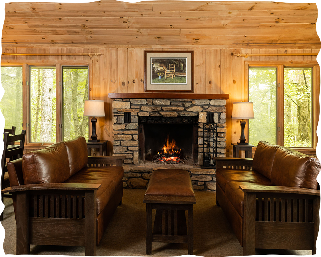 a living room with a fireplace and couches