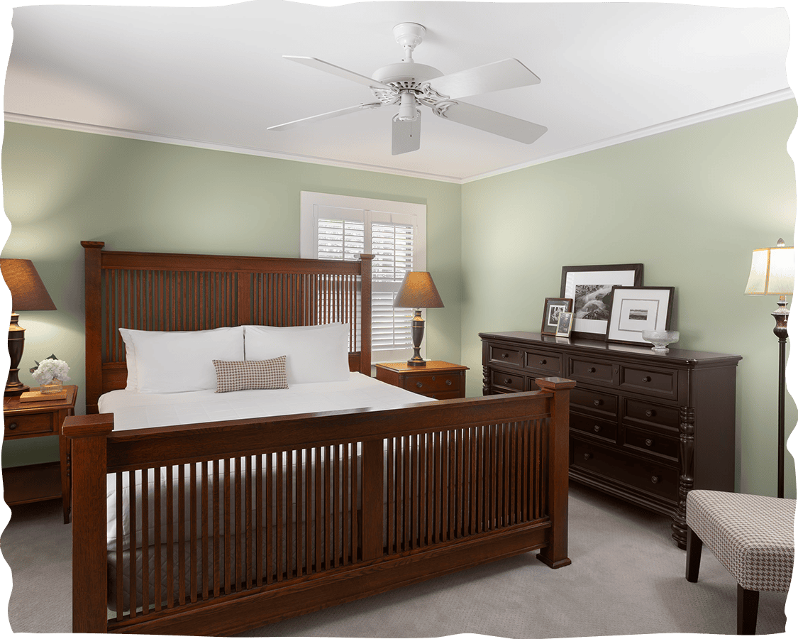 a bedroom with a bed and dresser