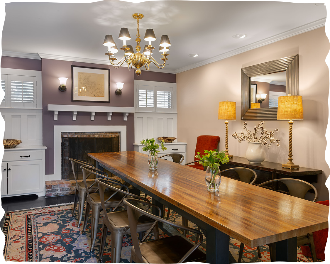 a room with a large table and chairs