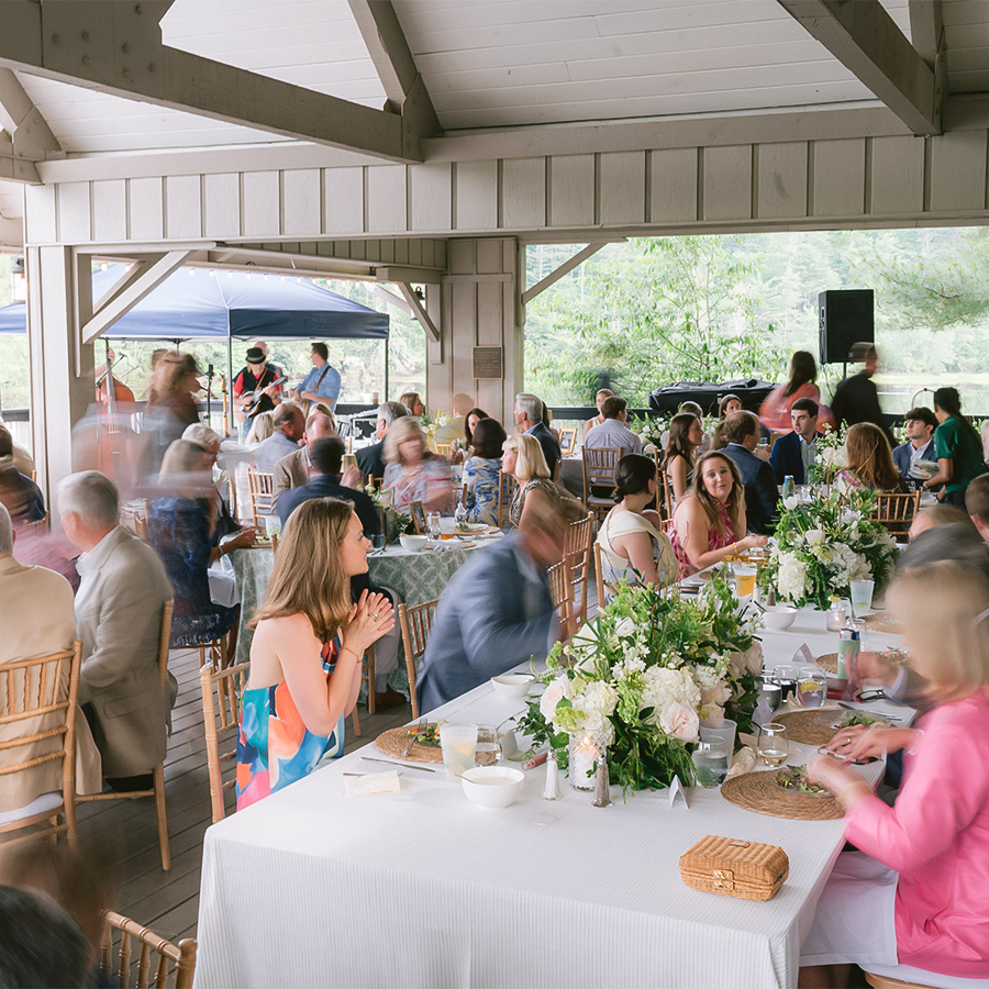 a group of people sitting at tables