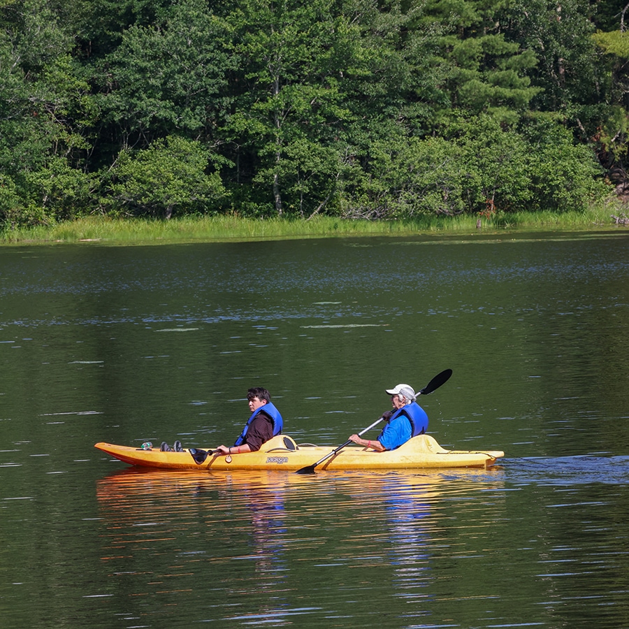 people kayaking on the lake