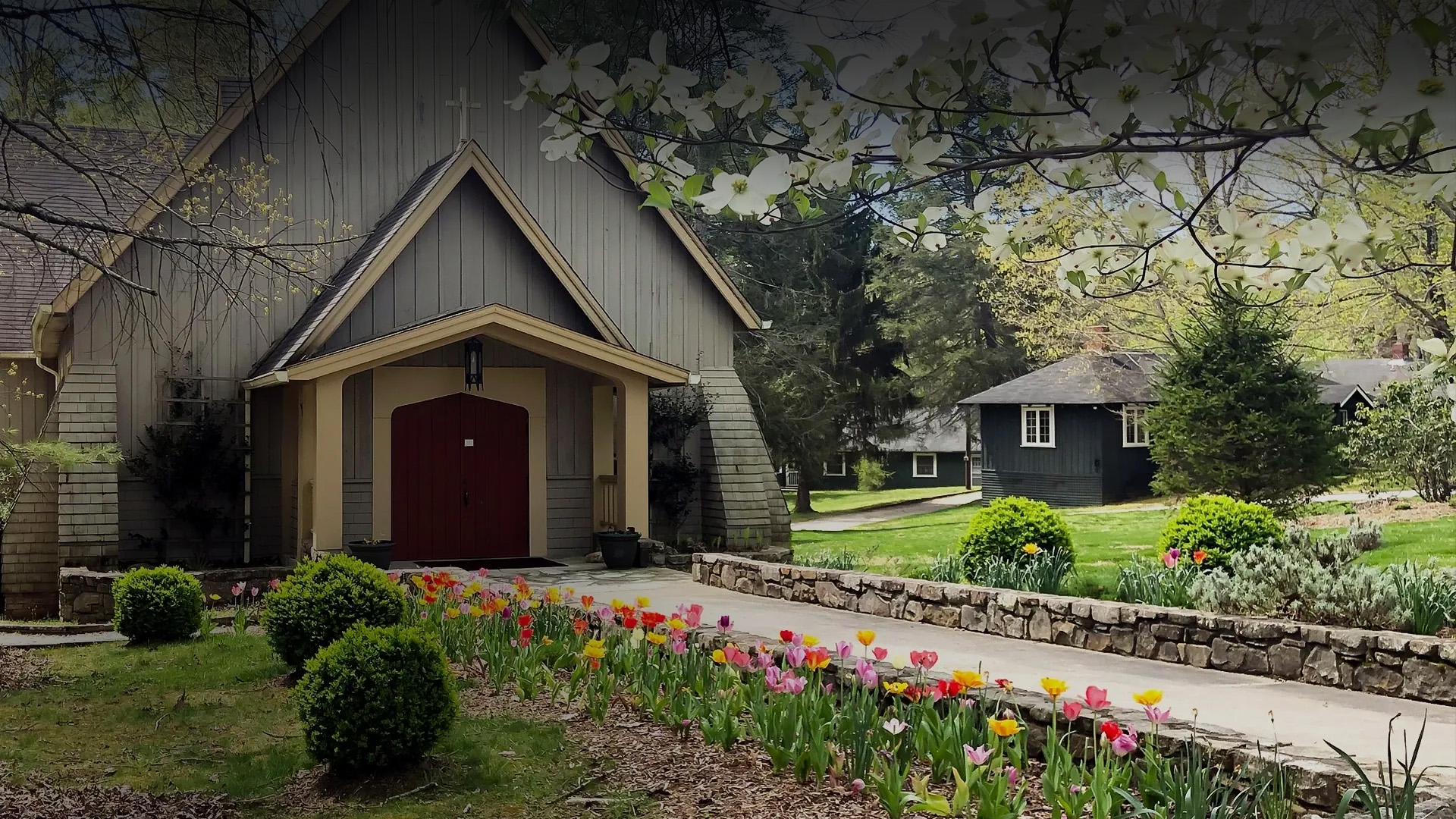 a house with a garden and flowers