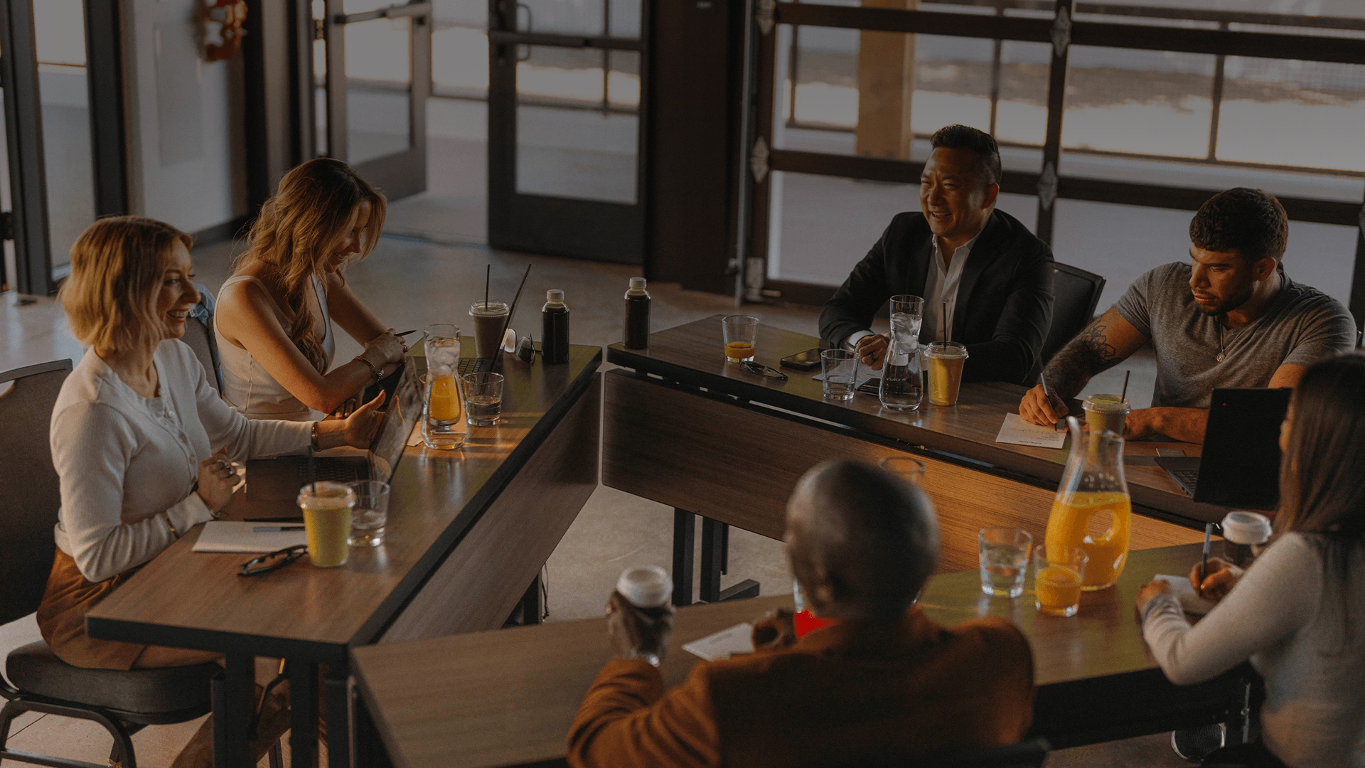 a group of people sitting at tables