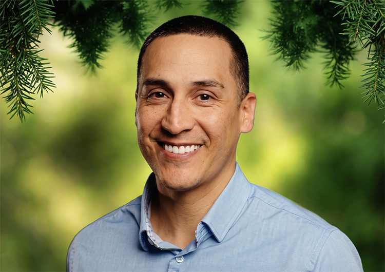a man smiling at the camera