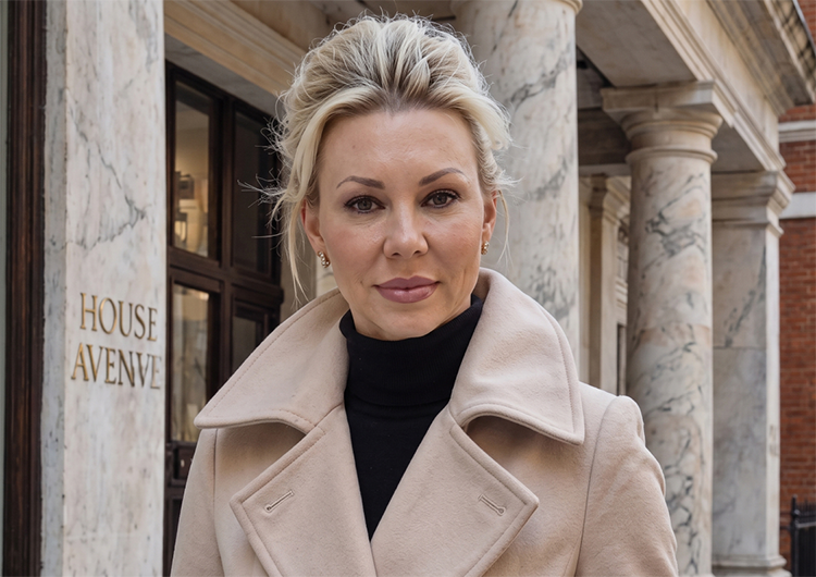 a woman in a beige coat
