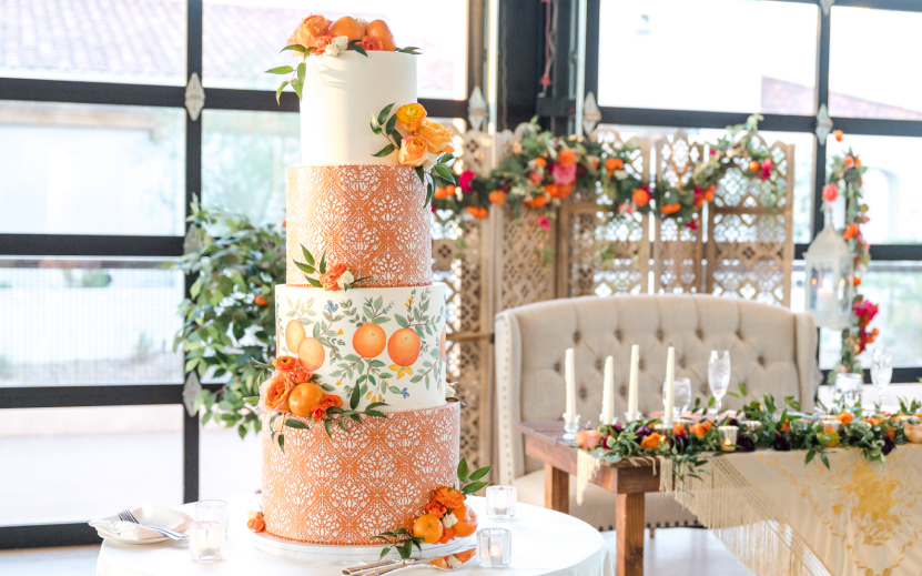 a cake with orange flowers on it