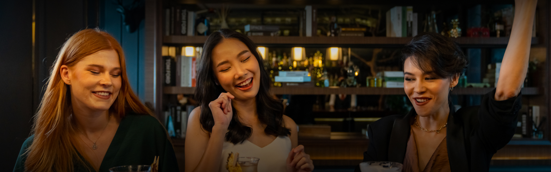 a woman smiling with her eyes closed
