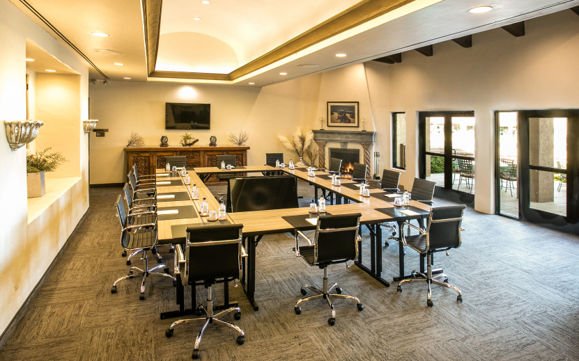 a conference room with a table and chairs