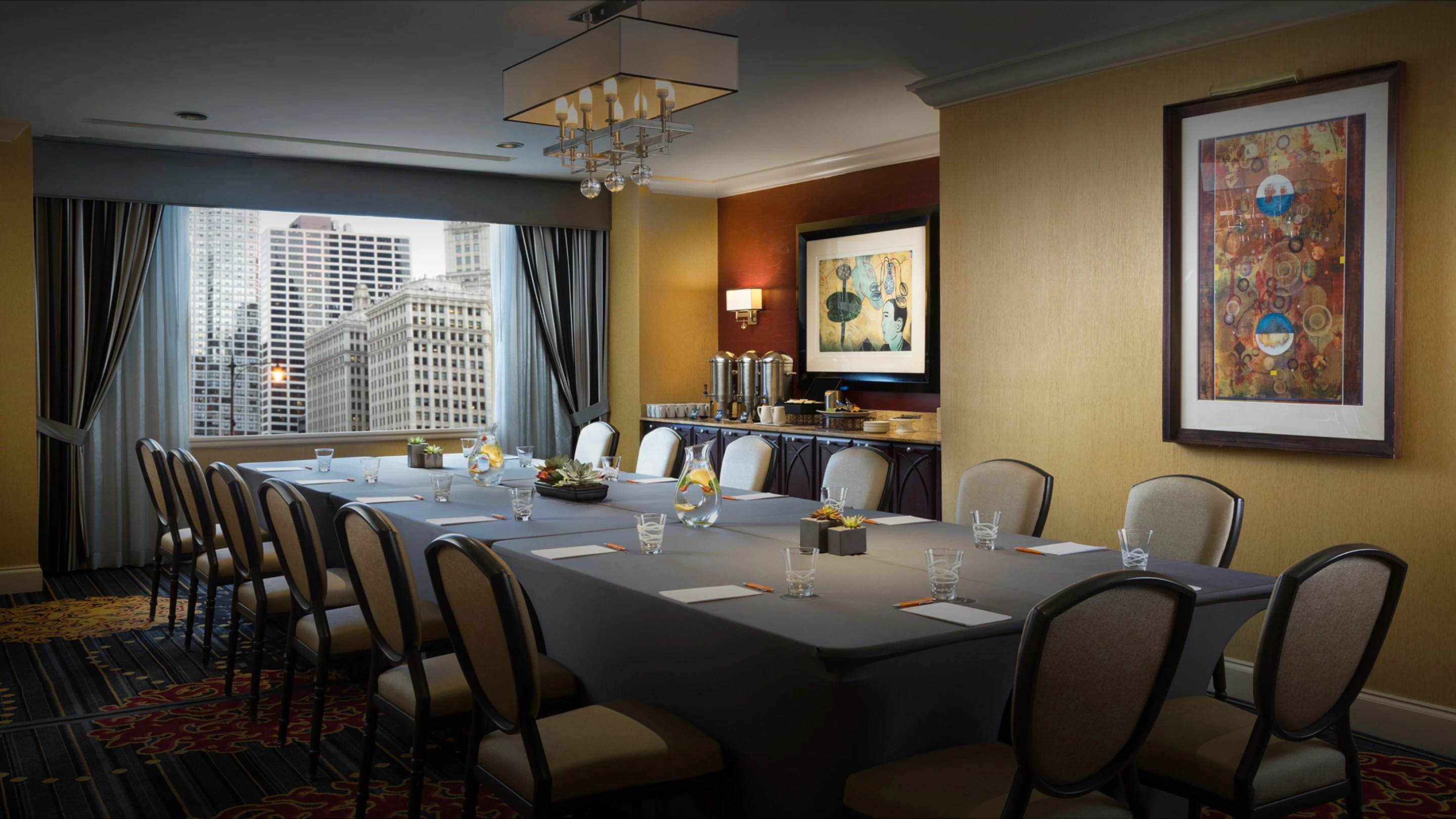 a room with a long table and chairs