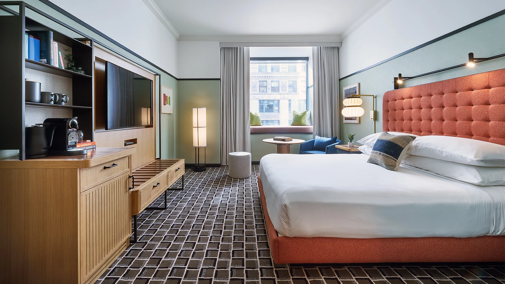 a room with a bed and a television