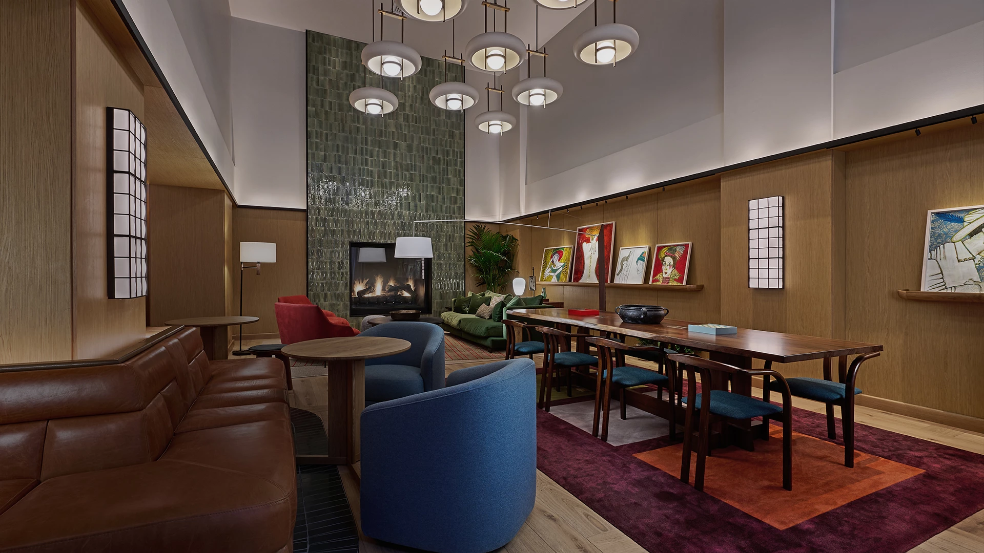 a room with a fireplace and chairs