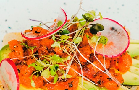 a plate of food with radish and sprouts