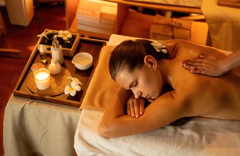 a woman lying on a massage table