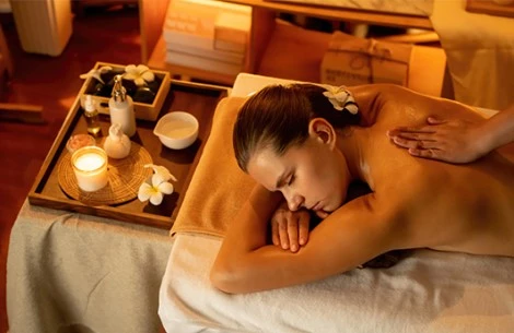 a woman lying on a massage table