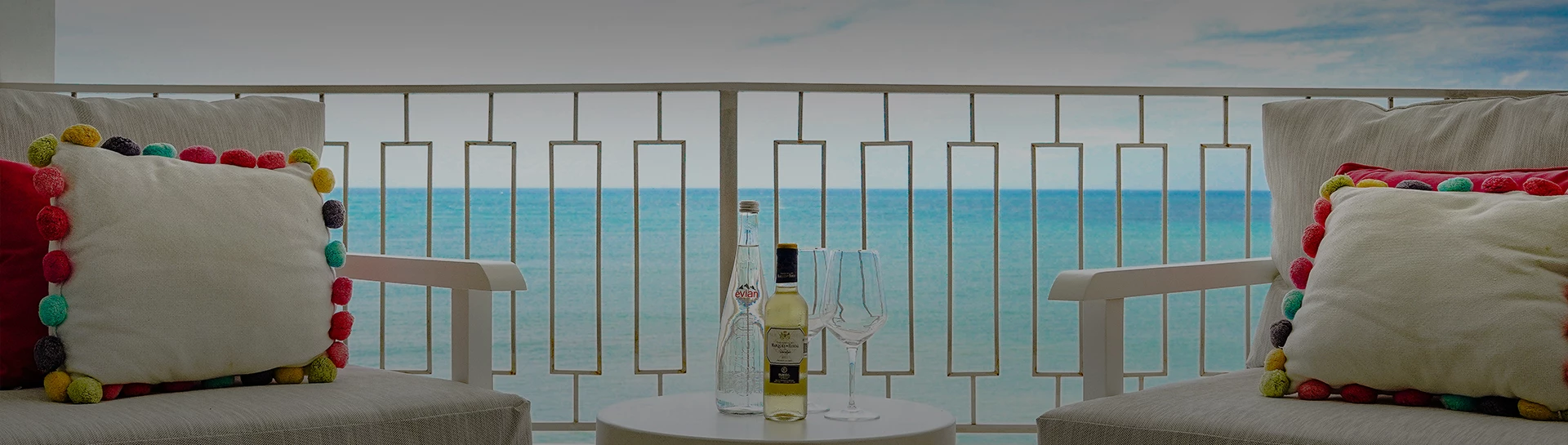 a bottle and glass on a table