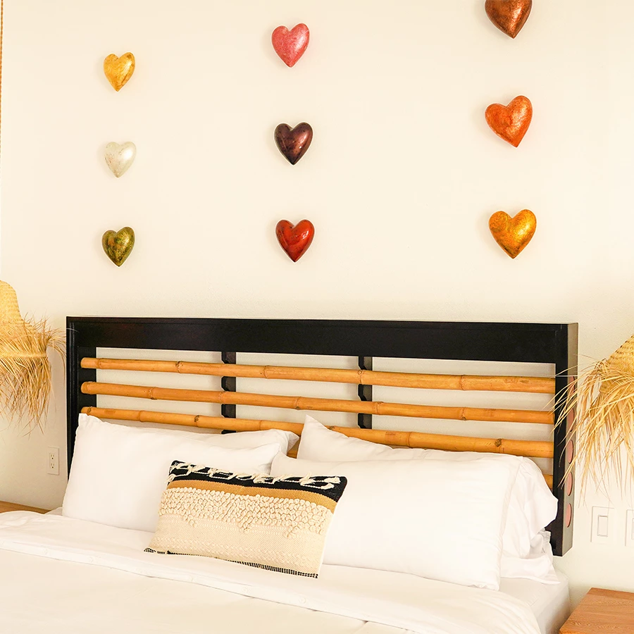 a bed with pillows and a headboard