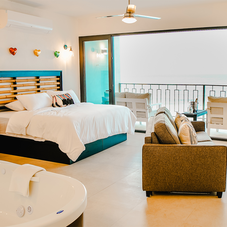 a room with a bed and a tub
