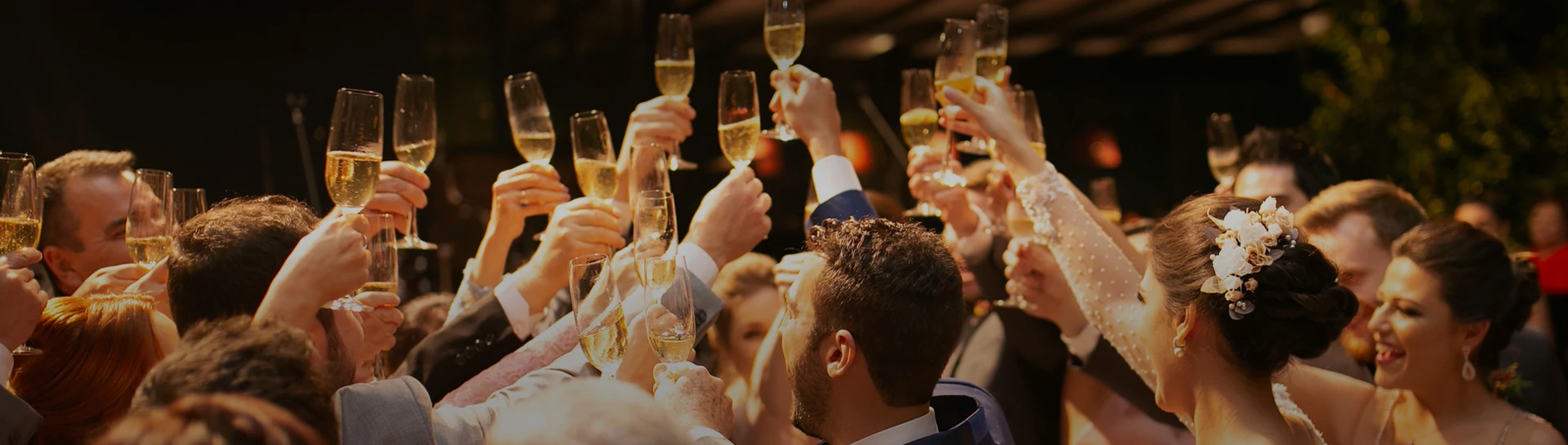 a group of people holding champagne glasses