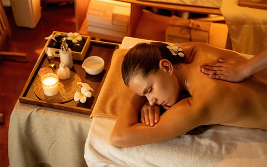 a woman lying on a massage table