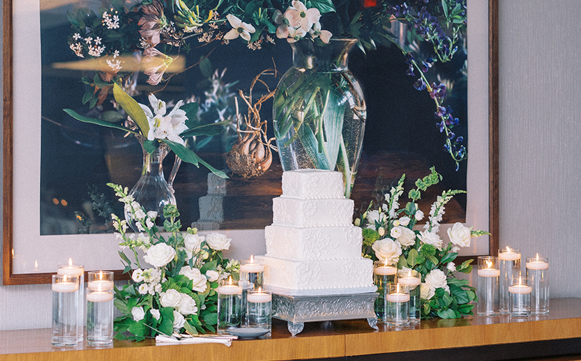 a cake with candles and flowers