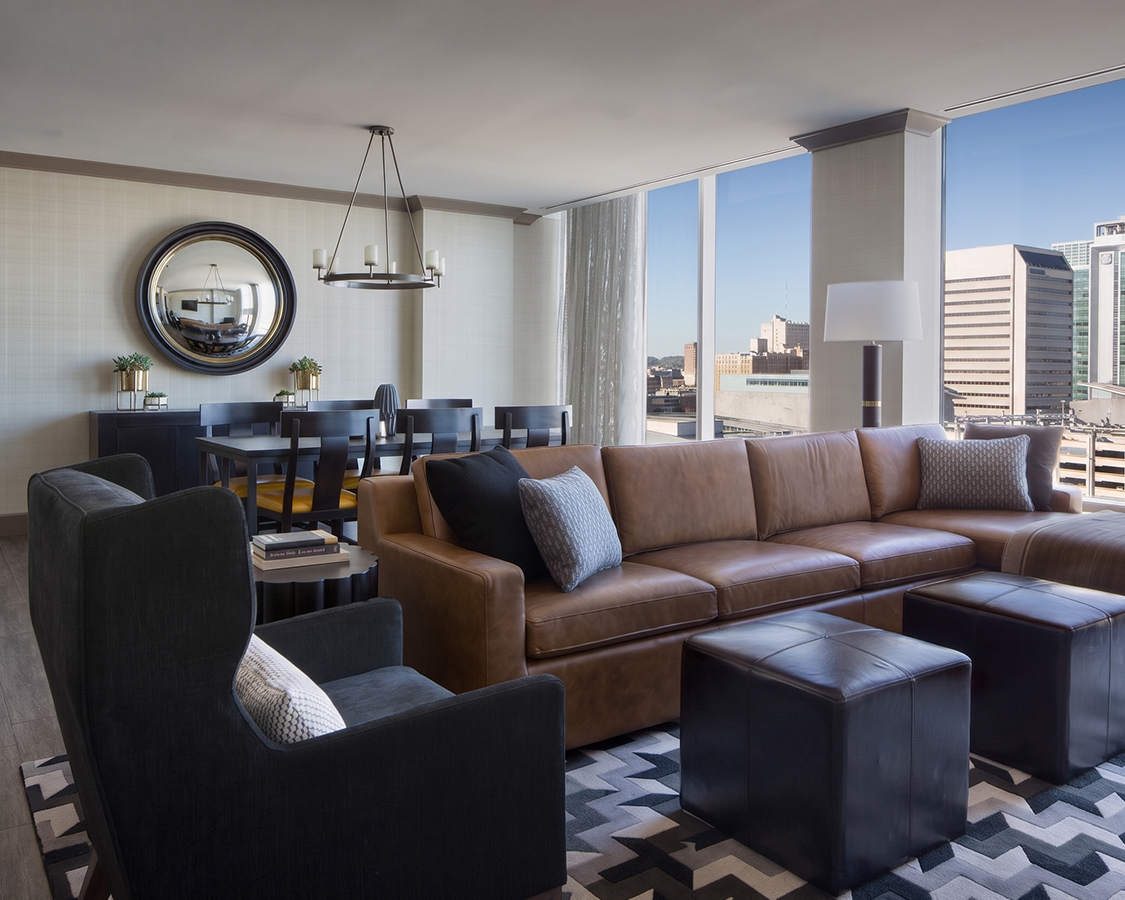 a living room with a large couch and a table