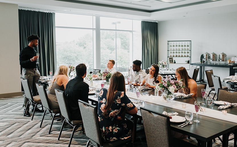 a group of people sitting at a table