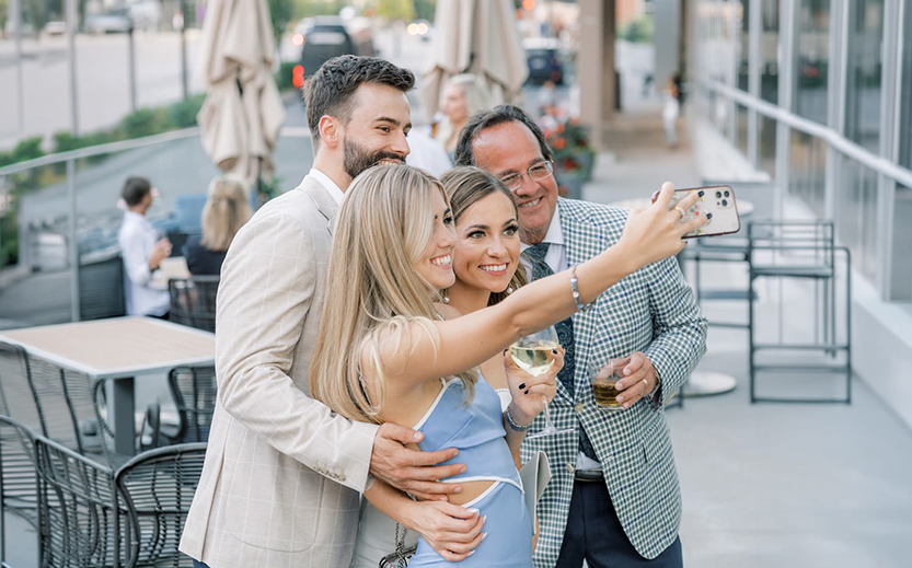 a group of people taking a selfie