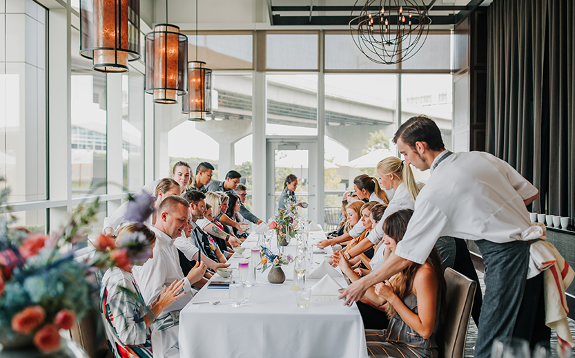 a group of people sitting at a table