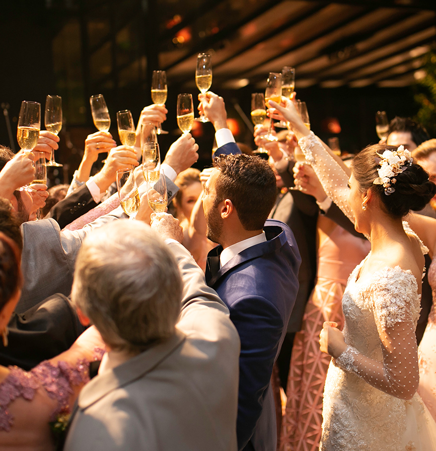 a group of people holding champagne glasses