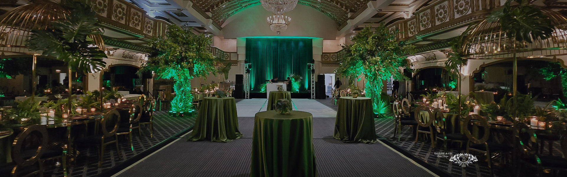 a room with tables and green curtains