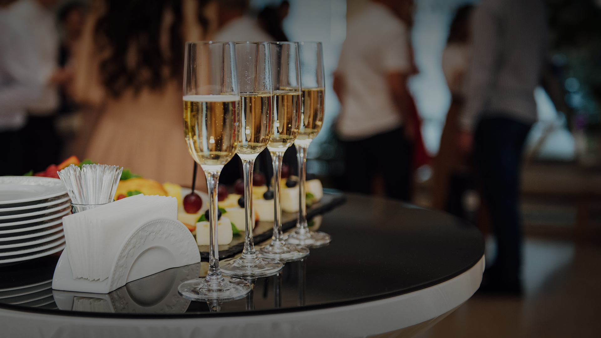 a row of champagne glasses on a table