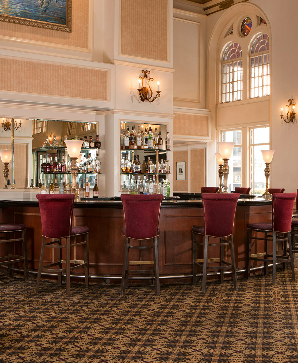 a bar with chairs and a counter