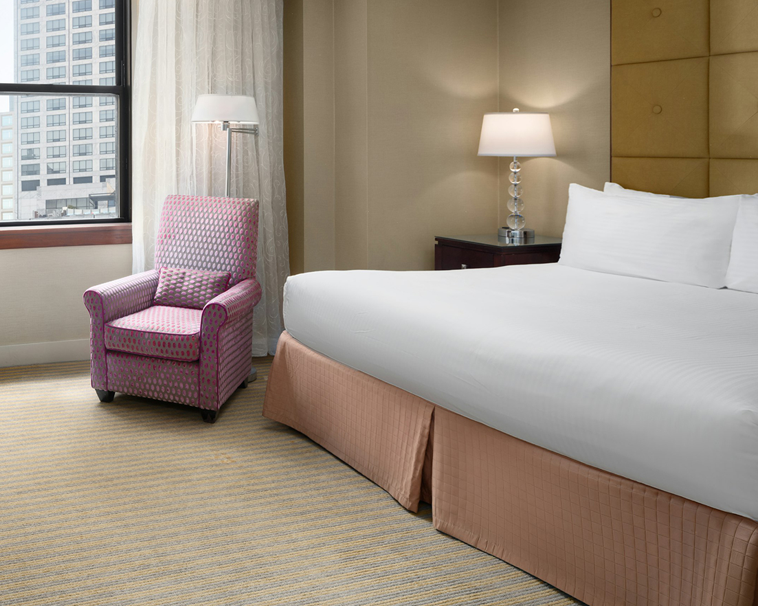 a bed and a chair in a room