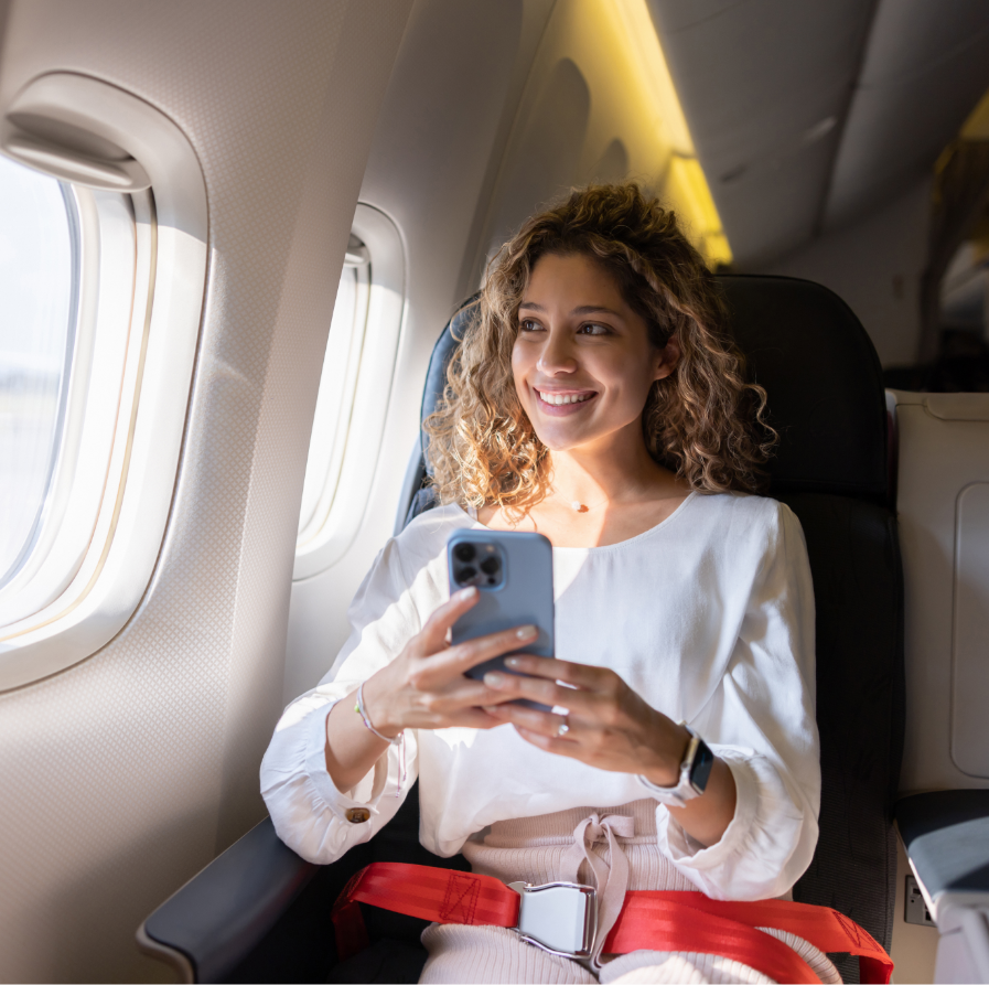 a woman sitting in a chair holding a phone