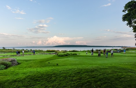 a group of people on a golf course