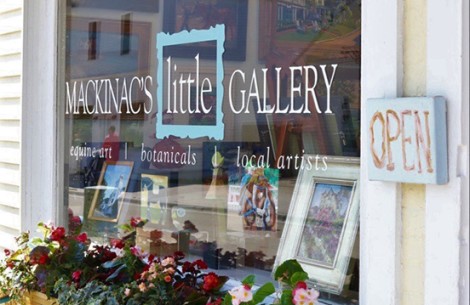 a window of a store with flowers