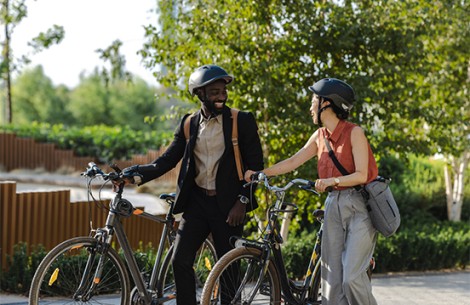 a man and woman with bicycles