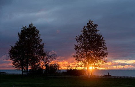 a sunset over a body of water